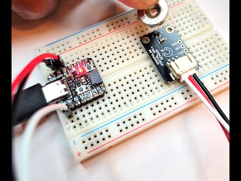 DRV5032 Hall Effect Sensor Breakout wired up on a breadboard next to a magnet